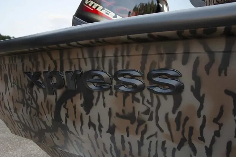 Slide: The Image of 2026 Xpress H190B Bay boat with camouflage design and embossed logo. - 18