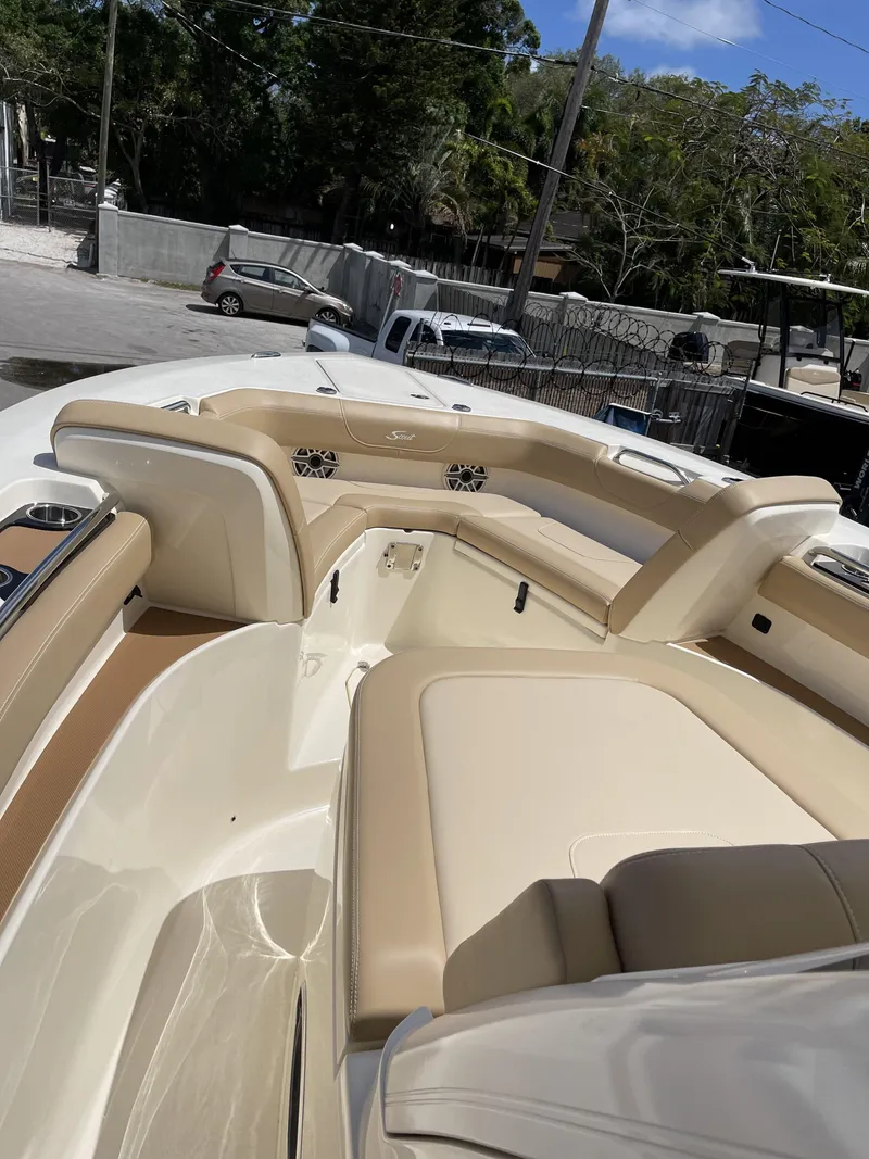 Slide: The Image of Interior of 2026 Scout 305 LXF boat with beige seating. - 4
