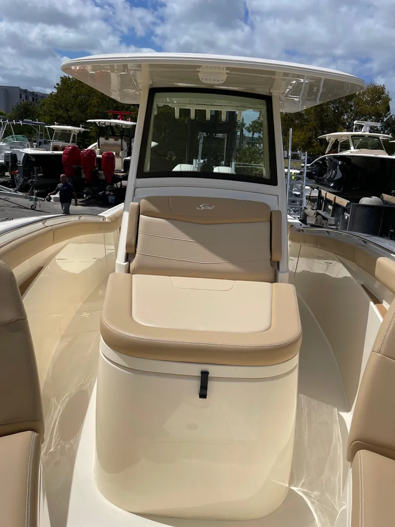Slide: The Image of Scout 305 LXF 2026 boat with luxurious seating area. - 7