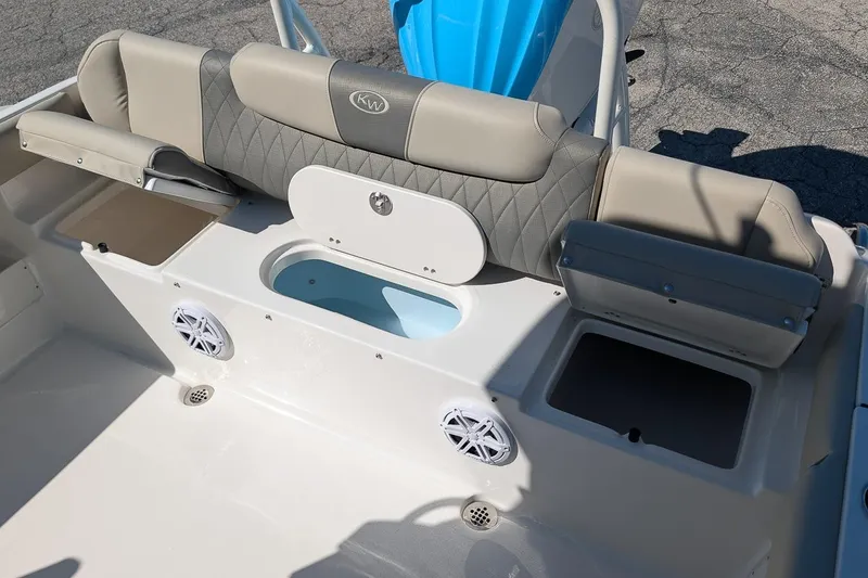 Slide: The Image of 2026 Key West 239 FS boat interior with seating and storage compartments. - 10