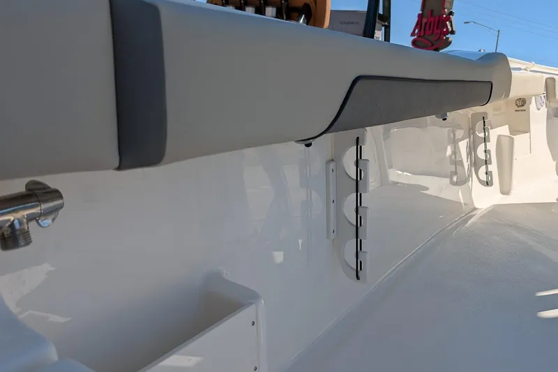 Slide: The Image of 2026 Key West 239 FS boat interior, featuring sleek white design and cushioned seating. - 11
