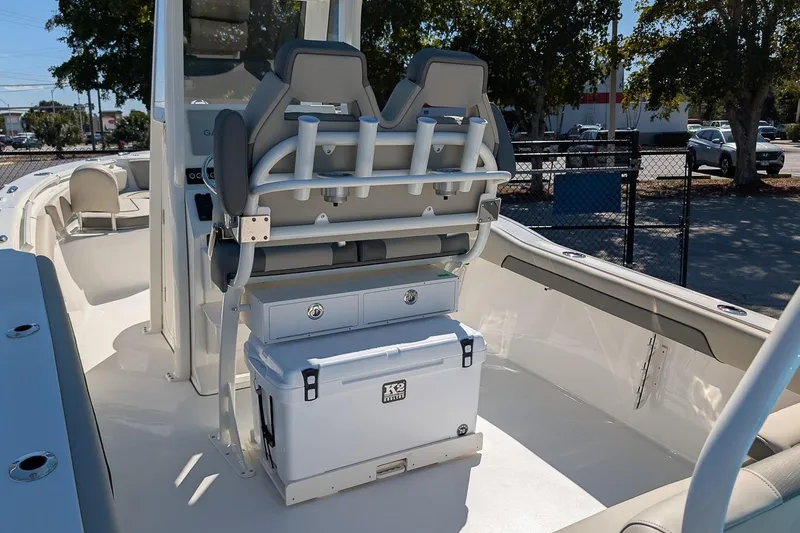 Slide: The Image of 2026 Key West 239 FS boat interior with seating and storage features. - 13