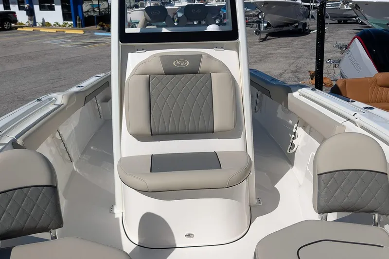 Slide: The Image of 2026 Key West 239 FS boat interior with gray seating and modern design. - 17