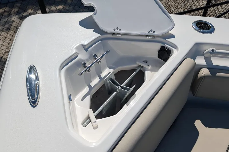 Slide: The Image of Open anchor compartment on 2026 Key West 239 FS boat, showcasing storage design. - 19