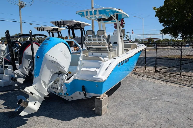 Slide: The Image of 2026 Key West 239 FS boat with Yamaha engine, displayed outdoors. - 4