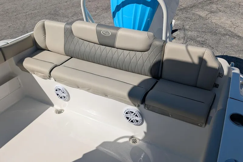 Slide: The Image of 2026 Key West 239 FS boat seating with gray upholstery and integrated speakers. - 9