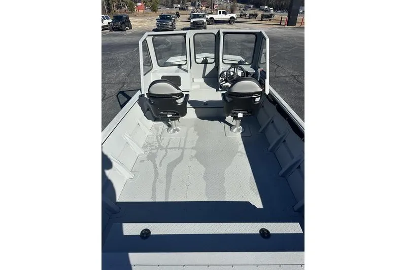 Slide: The Image of 2025 SeaArk 2072 MVT boat interior with dual seats and steering console. - 12
