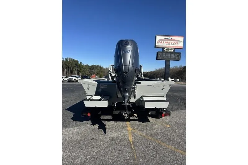 Slide: The Image of 2025 SeaArk 2072 MVT boat with powerful outboard motor, parked outdoors. - 3