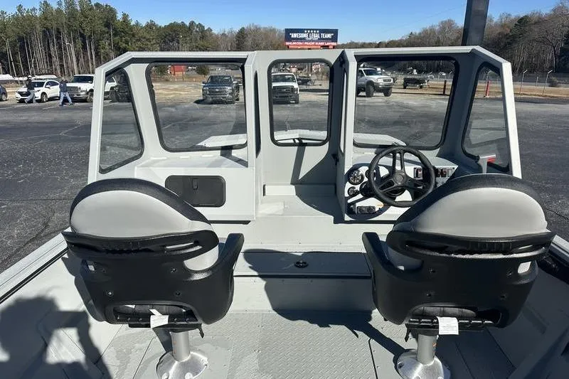 Slide: The Image of Interior view of 2025 SeaArk 2072 MVT boat with dual seats and steering console. - 9