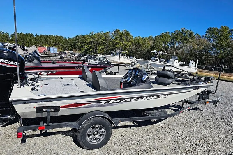 The Image of 2021 Tracker Pro Team 175 TXW Tournament Edition boat on trailer, parked outdoors. - 1