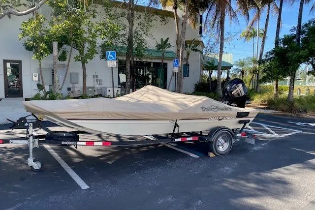 Slide: The Image of 2022 Tracker Bass Tracker Classic XL boat on trailer, parked outdoors. - 12
