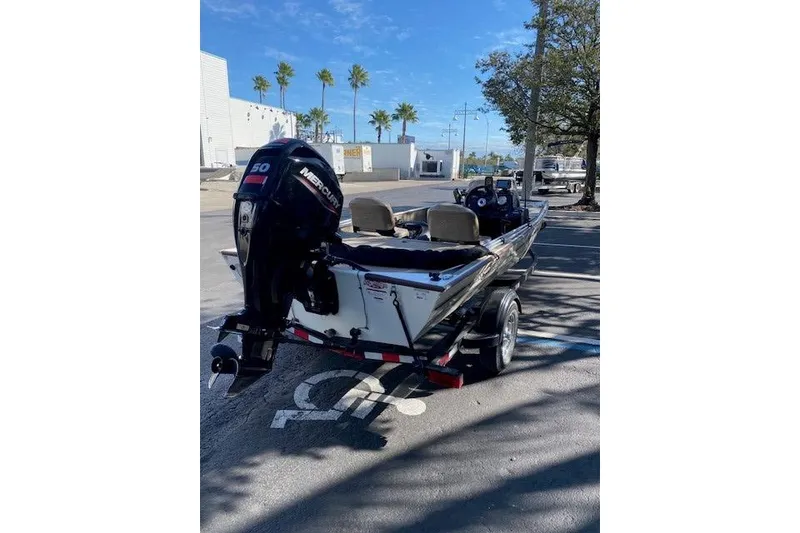 Slide: The Image of 2022 Tracker Bass Tracker Classic XL boat with Mercury engine in parking lot. - 3