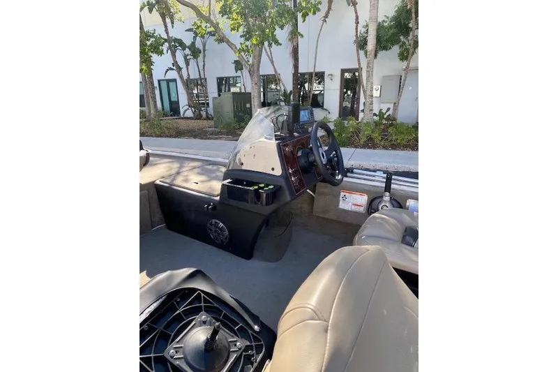 Slide: The Image of 2022 Tracker Bass Tracker Classic XL boat interior with steering console and seating. - 7