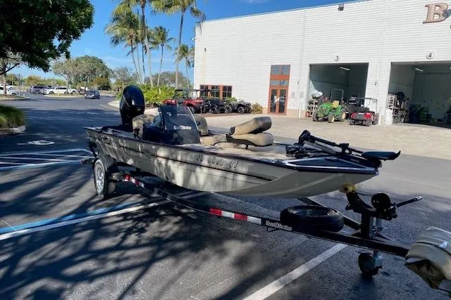 Slide: The Image of 2022 Tracker Bass Tracker Classic XL boat on trailer, parked outside a dealership. - 8