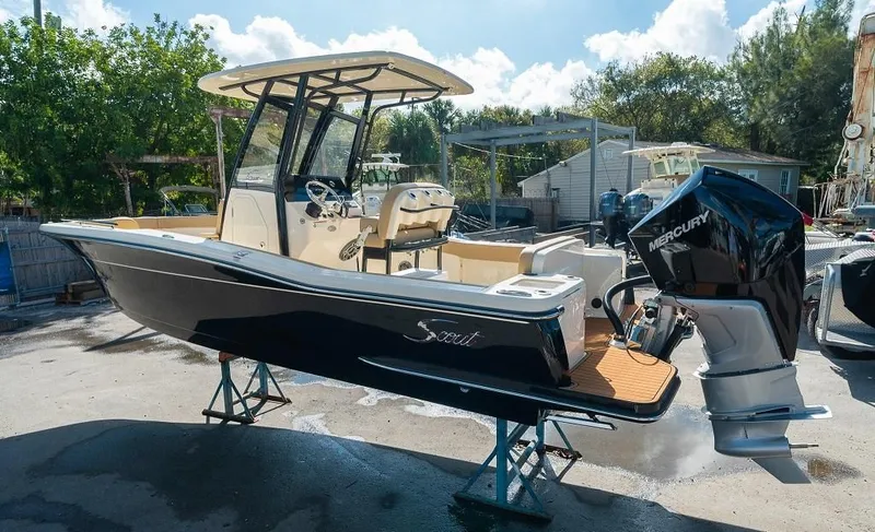 The Image of Scout 240 XSF 2026 boat with Mercury engine on stands. - 0
