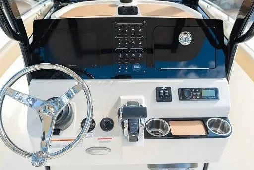 Slide: The Image of 2026 Scout 240 XSF helm with modern controls and steering wheel. - 1