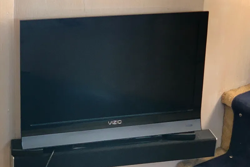 Slide: The Image of Vizio TV on 1991 Hatteras 40 Motor Yacht interior. - 100