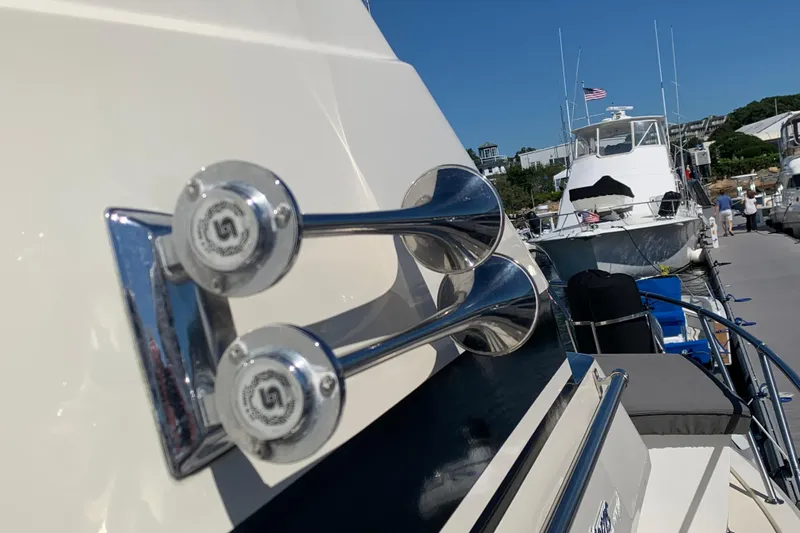 Slide: The Image of Close-up of a 1991 Hatteras 40 Motor Yacht horn, docked with other boats. - 112