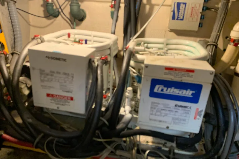 Slide: The Image of Engine room of 1991 Hatteras 40 Motor Yacht with Dometic and Cruisair units. - 114