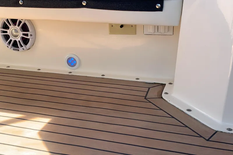 Slide: The Image of 1991 Hatteras 40 Motor Yacht deck with speaker and LED lights. - 129