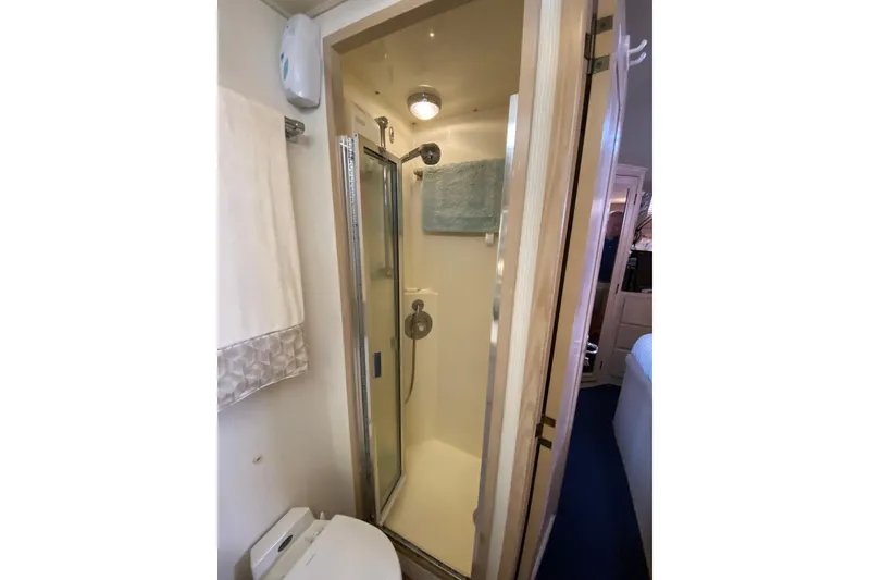Slide: The Image of Bathroom interior of 1991 Hatteras 40 Motor Yacht with shower and towel rack. - 30
