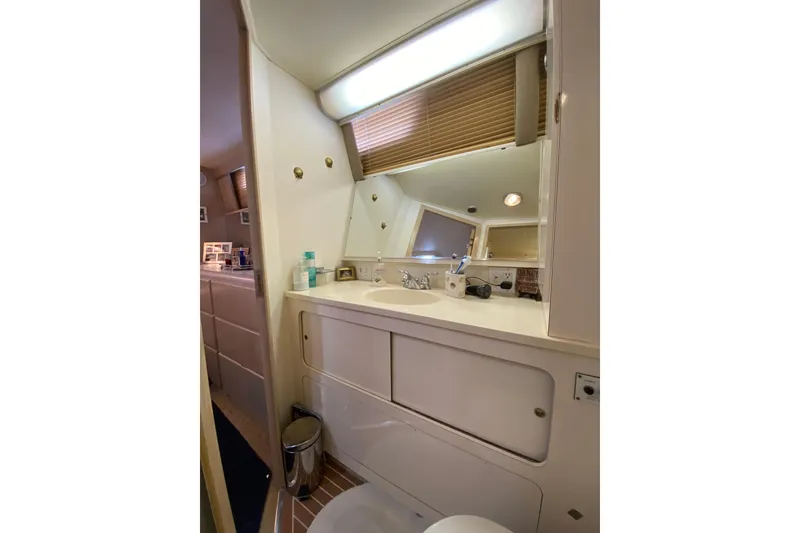 Slide: The Image of Bathroom interior of 1991 Hatteras 40 Motor Yacht with sink and mirror. - 34