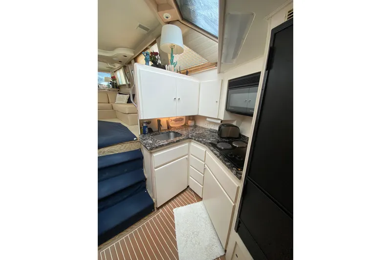 Slide: The Image of Interior of 1991 Hatteras 40 Motor Yacht kitchen with modern appliances and sleek design. - 39