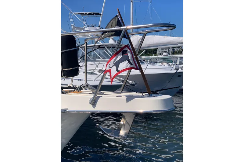 Slide: The Image of 1991 Hatteras 40 Motor Yacht with nautical flag, docked in marina. - 4