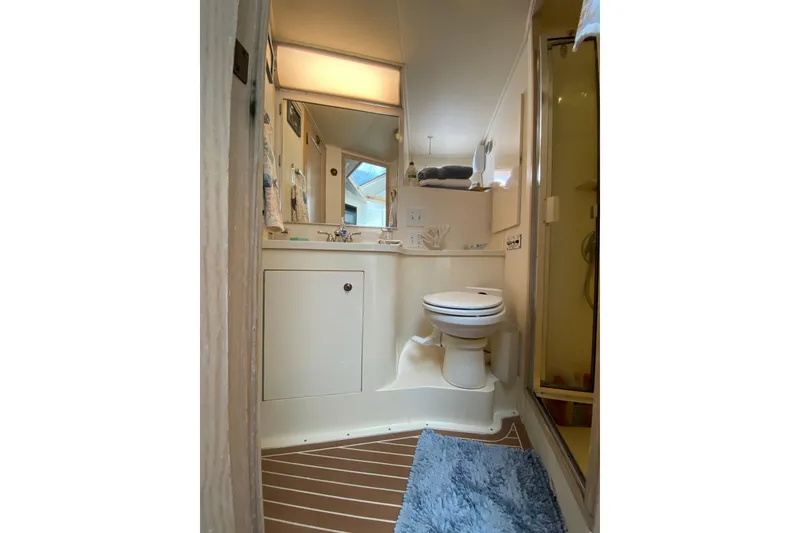Slide: The Image of Bathroom interior of 1991 Hatteras 40 Motor Yacht with shower and toilet. - 45