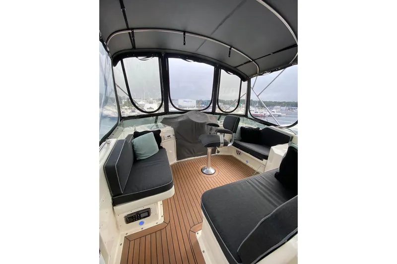 Slide: The Image of Interior view of 1991 Hatteras 40 Motor Yacht with seating and helm. - 48
