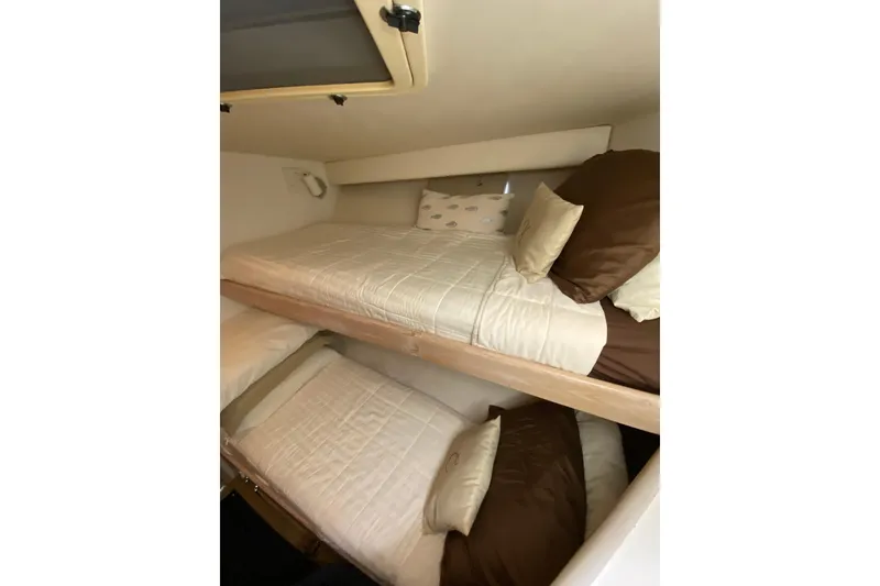 Slide: The Image of Bunk beds in 1991 Hatteras 40 Motor Yacht cabin with cozy bedding. - 53