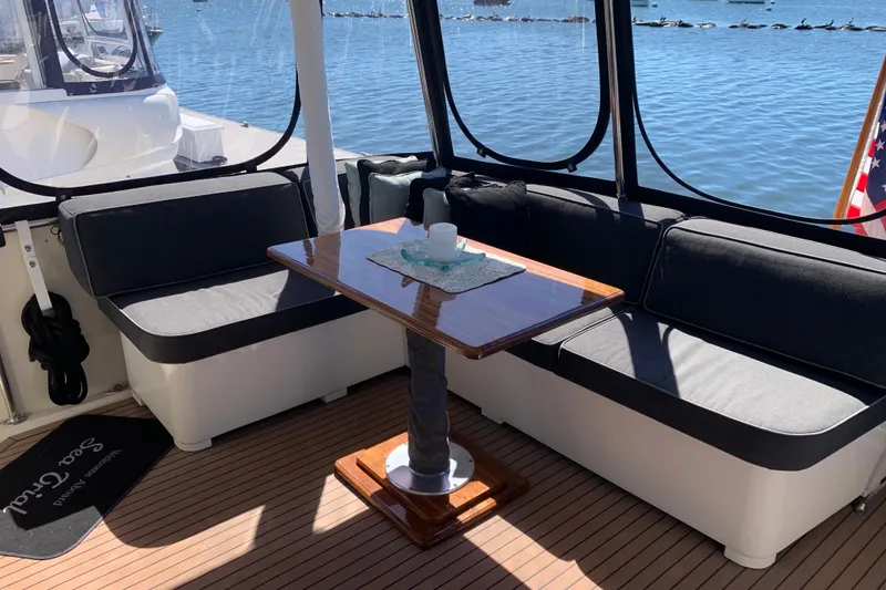 Slide: The Image of Cozy seating area on 1991 Hatteras 40 Motor Yacht with waterfront view. - 57