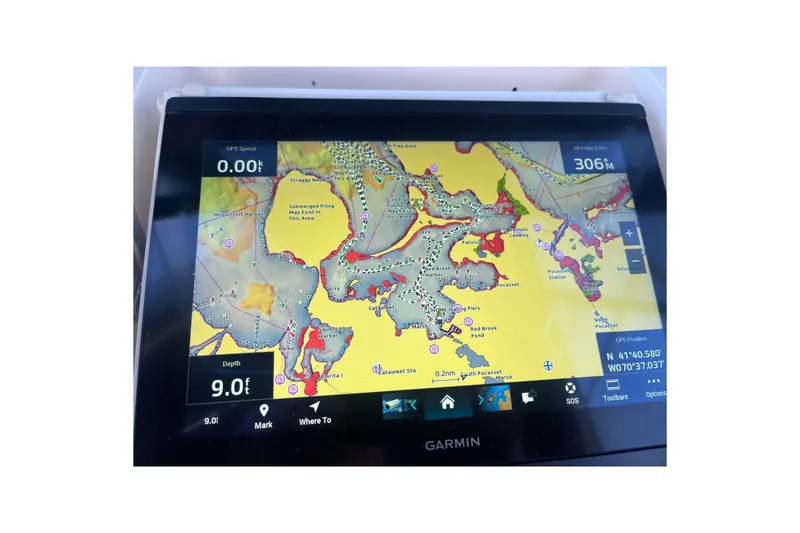 Slide: The Image of Garmin GPS display on 1991 Hatteras 40 Motor Yacht, showing nautical chart and navigation details. - 66