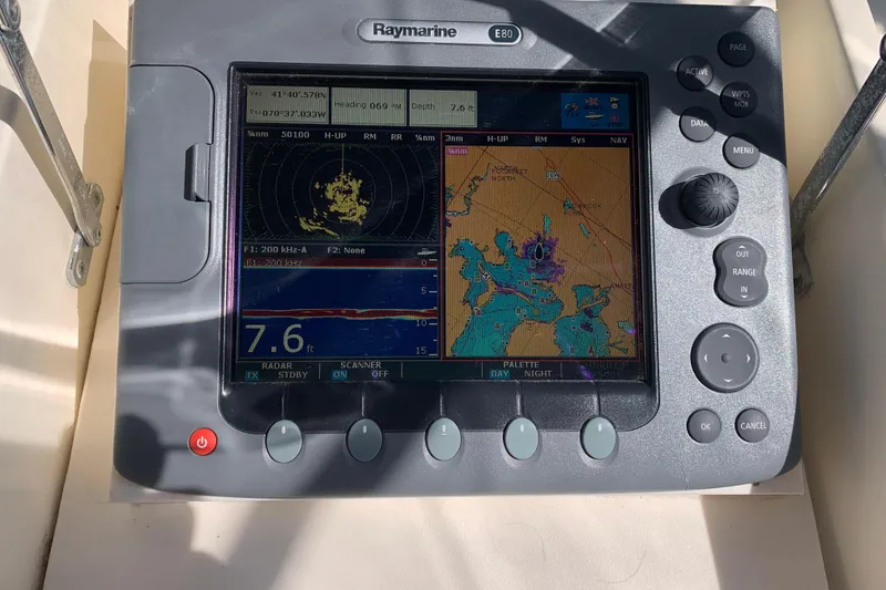 Slide: The Image of Raymarine E80 navigation display on 1991 Hatteras 40 Motor Yacht, showing radar and map. - 70
