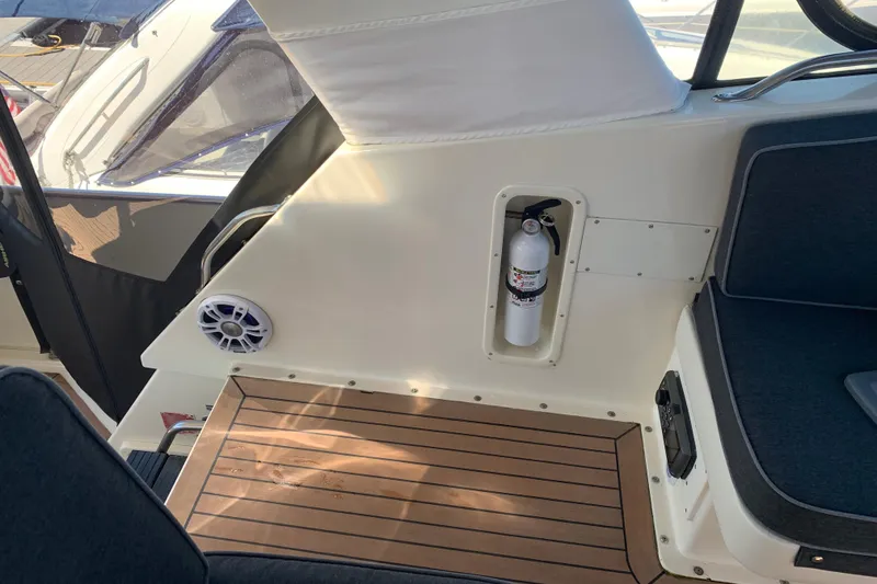 Slide: The Image of 1991 Hatteras 40 Motor Yacht interior with fire extinguisher and speaker. - 82