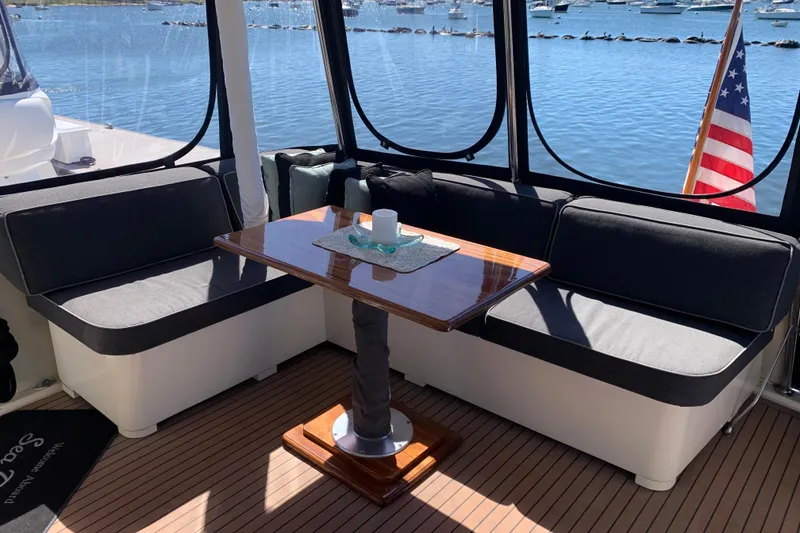 Slide: The Image of Cozy seating area on 1991 Hatteras 40 Motor Yacht with scenic water view. - 87