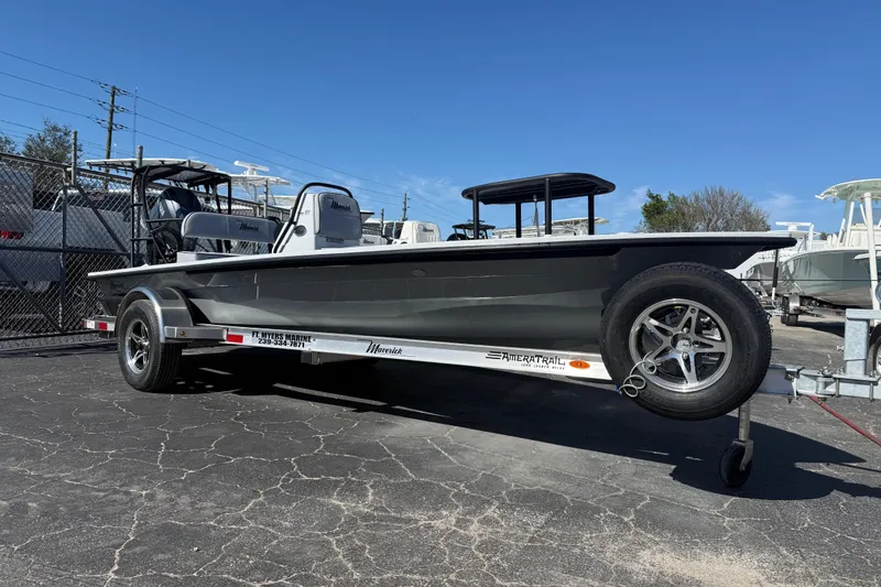 The Image of 2026 Maverick 17 HPX-S boat on trailer, parked outdoors under clear blue sky. - 1