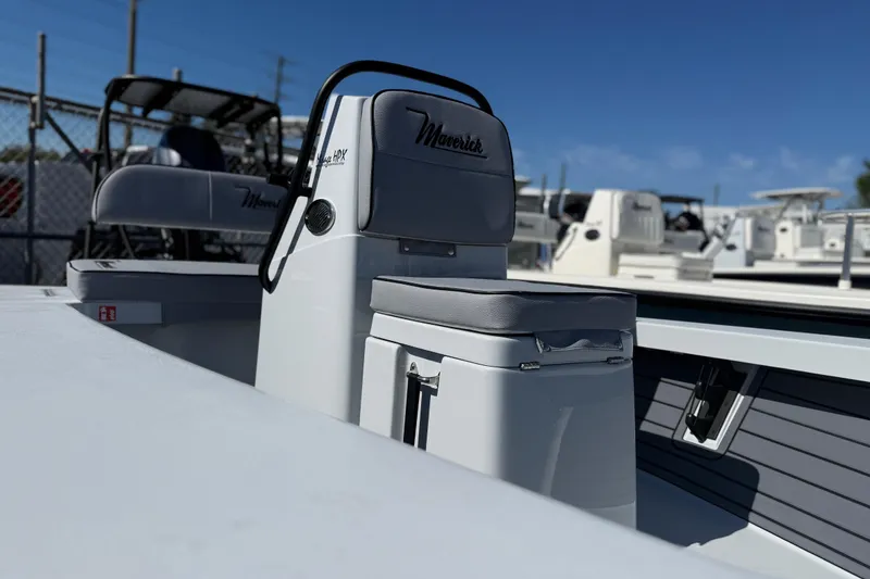 Slide: The Image of 2026 Maverick 17 HPX-S boat interior with seating and console, displayed outdoors. - 11