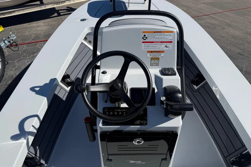 Slide: The Image of 2026 Maverick 17 HPX-S boat console with steering wheel and controls. - 4