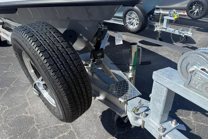 Slide: The Image of Trailer hitch and wheel of 2026 Maverick 17 HPX-S boat on asphalt. - 6
