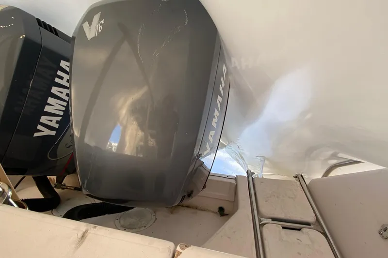 Slide: The Image of 1999 Grady-White Chase 263 with Yamaha V6 outboard engines. - 30