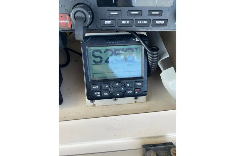 Slide: The Image of Simrad marine navigation system on 1999 Grady-White Chase 263 boat dashboard. - 37
