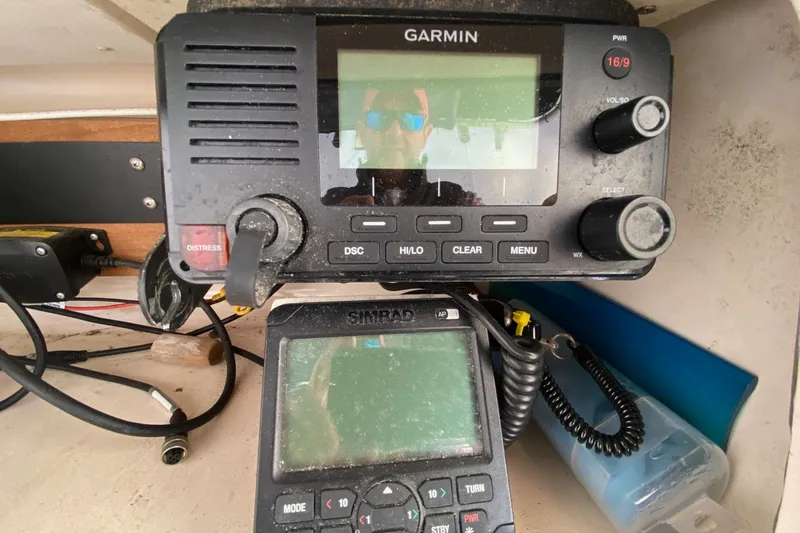Slide: The Image of Garmin and Simrad marine electronics on 1999 Grady-White Chase 263 boat dashboard. - 7