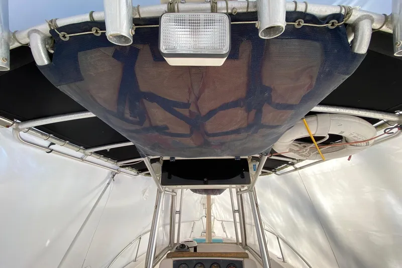 Slide: The Image of 1999 Grady-White Chase 263 boat interior with T-top and life preserver. - 8