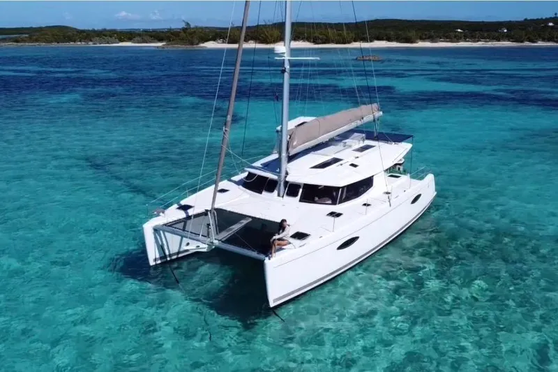 The Image of 2014 Fountaine Pajot Helia 44 catamaran sailing in clear turquoise waters. - 1