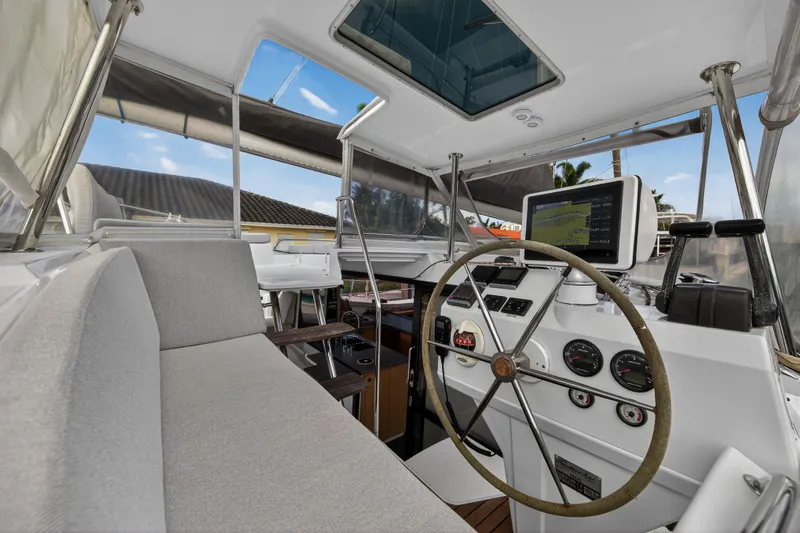 Slide: The Image of Interior view of 2014 Fountaine Pajot Helia 44 catamaran cockpit with steering wheel and navigation equipment. - 17