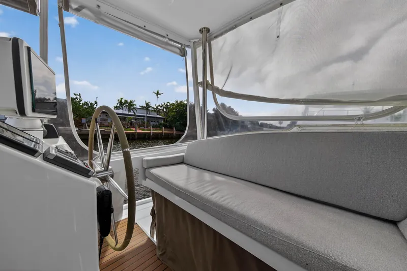 Slide: The Image of Helm and seating area of 2014 Fountaine Pajot Helia 44 catamaran, featuring a steering wheel. - 19