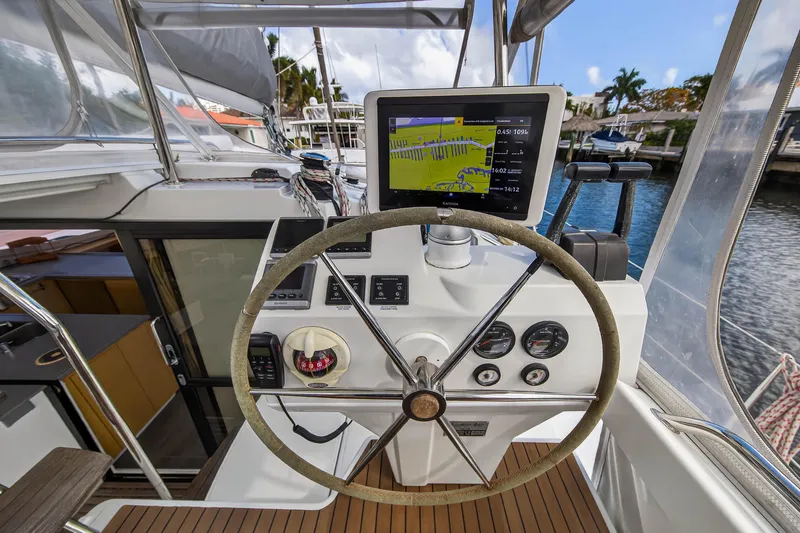 Slide: The Image of Helm of 2014 Fountaine Pajot Helia 44 catamaran with navigation display and controls. - 20