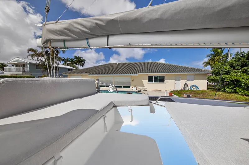 Slide: The Image of Fountaine Pajot Helia 44 catamaran deck view, showcasing spacious seating and clear skies. - 24