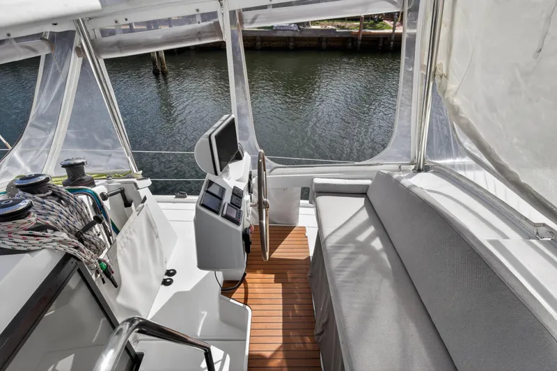 Slide: The Image of Helm station of 2014 Fountaine Pajot Helia 44 catamaran with seating and navigation equipment. - 28